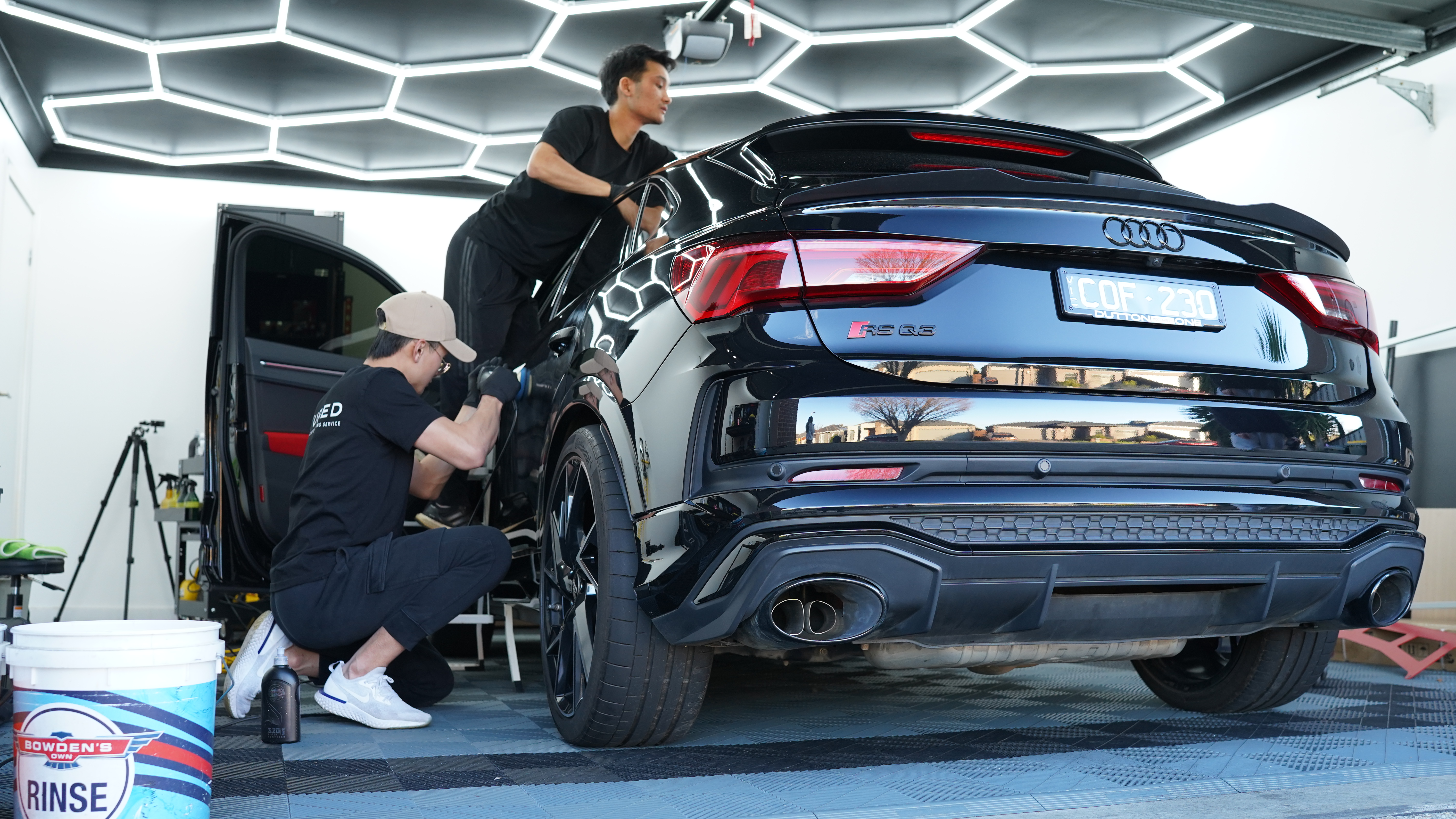 Cured Car Detailing technicians protecting a new Audi RS Q3 in the studio