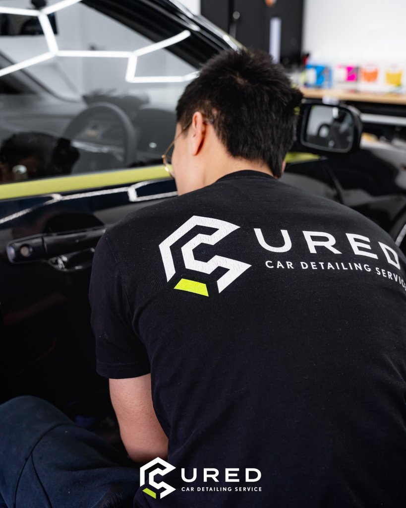 Cured Car Detailing technician perfecting interior detail at Cairnlea studio