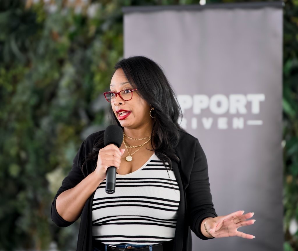 Ty Givens speaking at a conference
