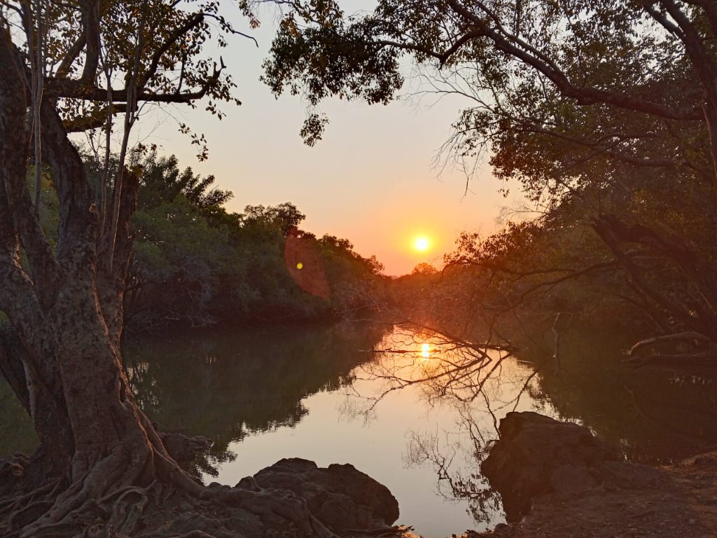 River sunset with rocky outcroppings