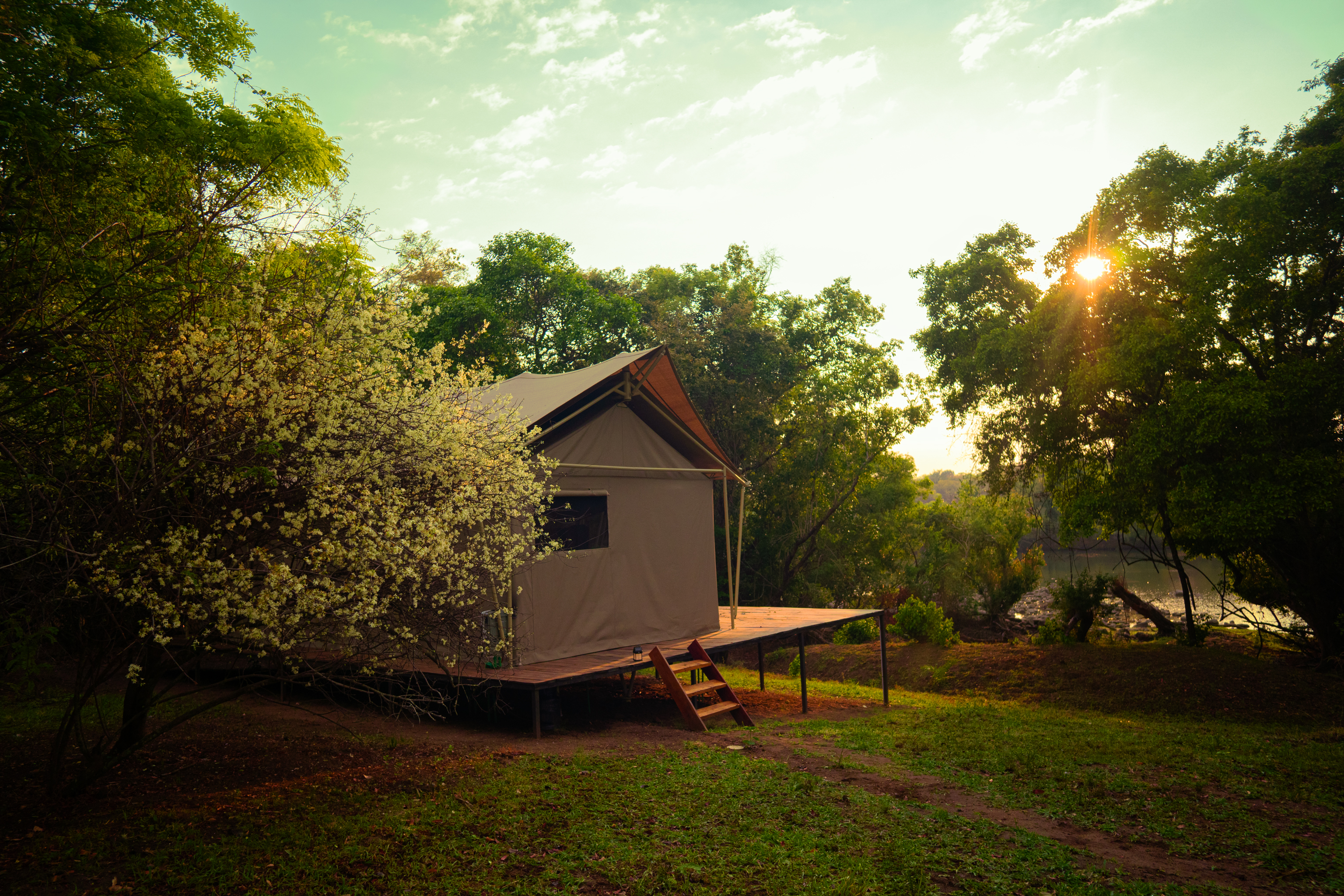Tauka Safari Camp luxury tent at golden hour overlooking the Kafue River