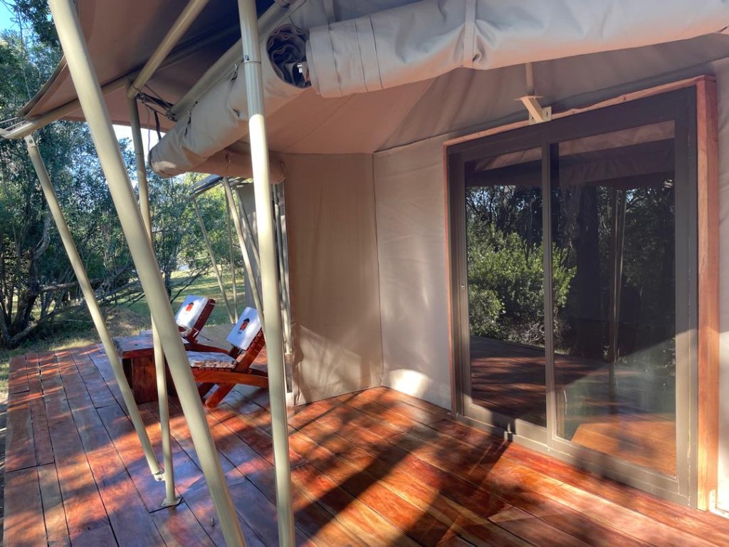 Safari tent with deck chairs and open view