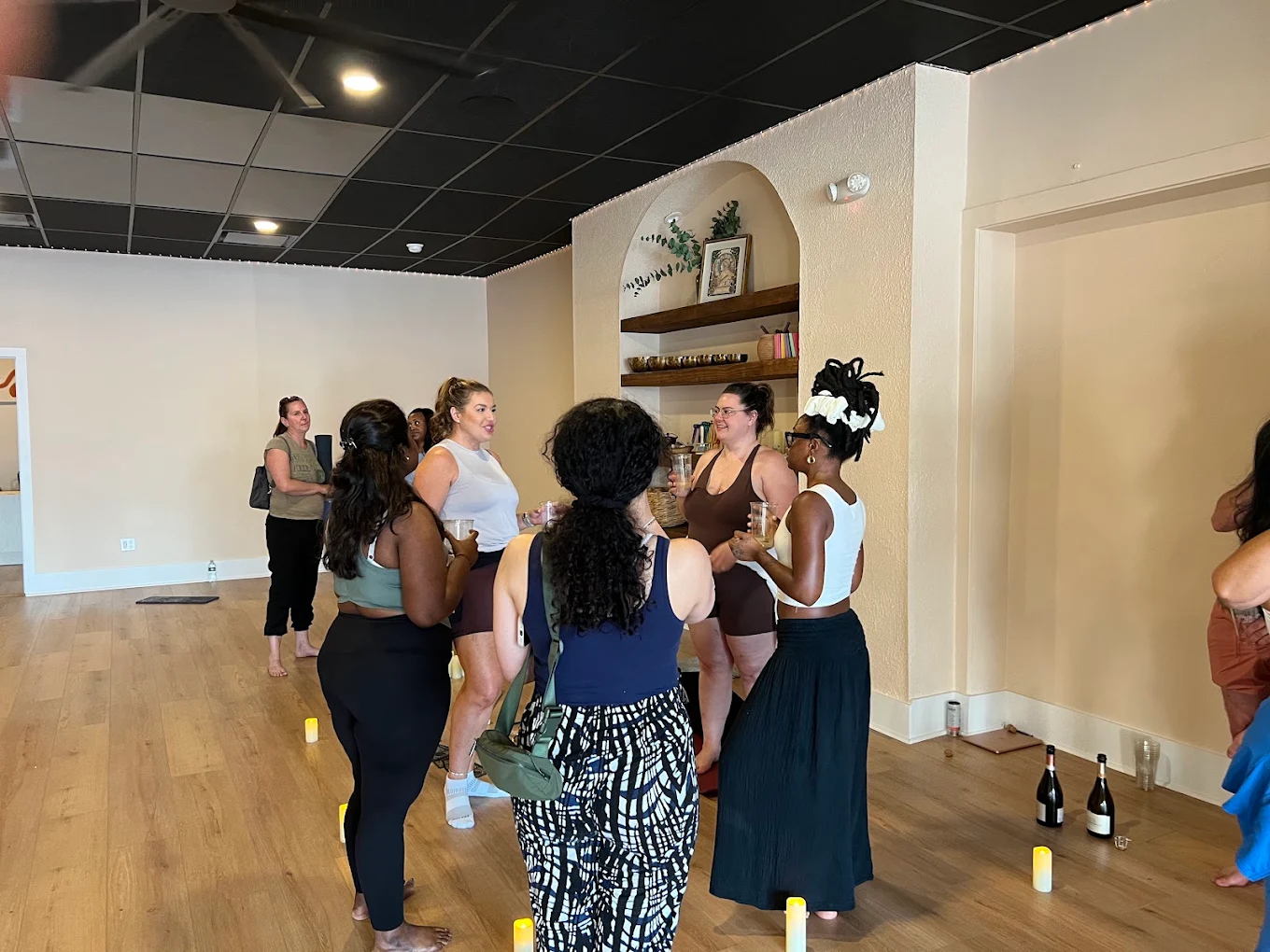 The Self Studio community members practicing yoga together