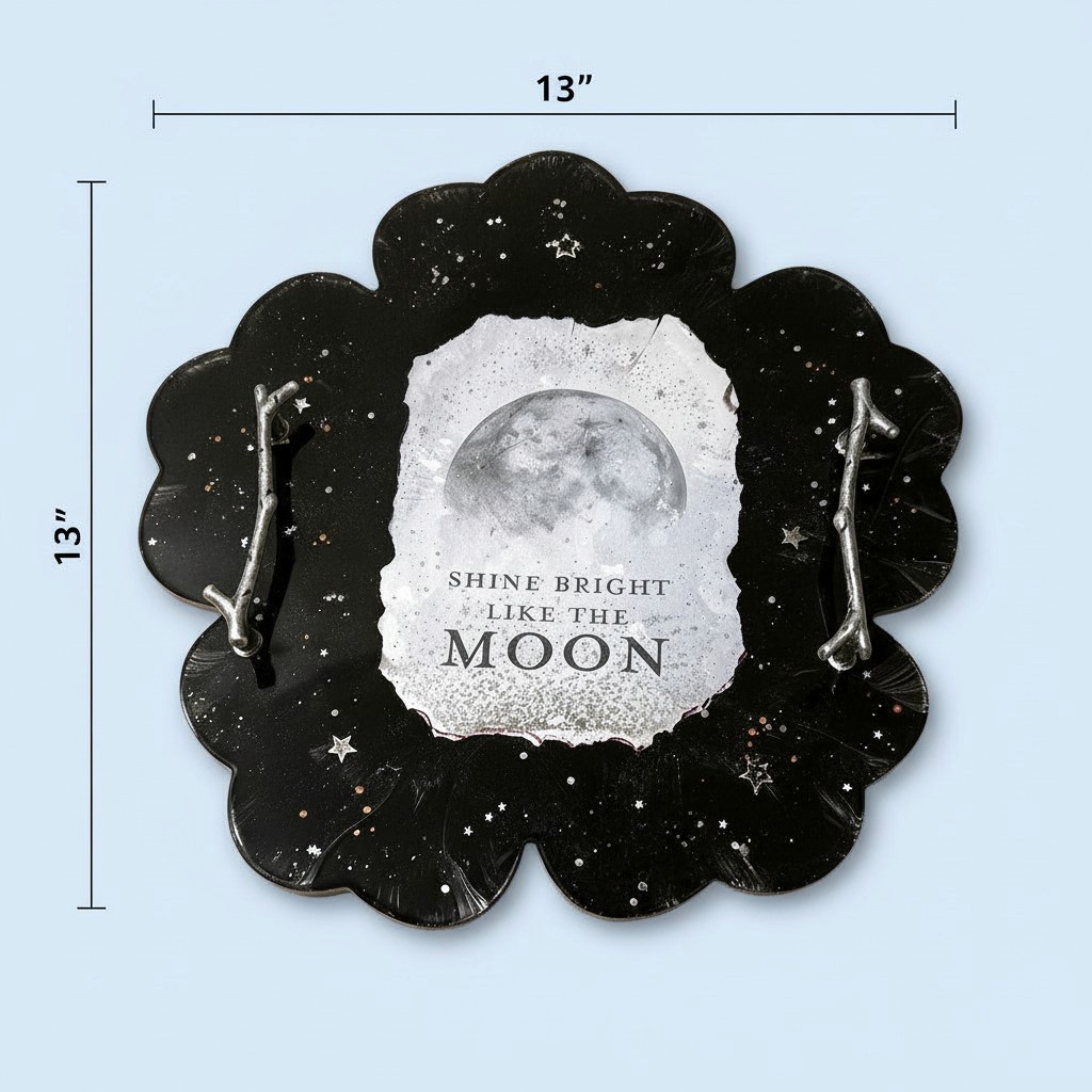 Mother Moon Tray - 13x13 inch glossy black resin tray with scalloped edges, silver branch handles, star-dusted finish, and a glowing moon centerpiece with SHINE BRIGHT LIKE THE MOON text