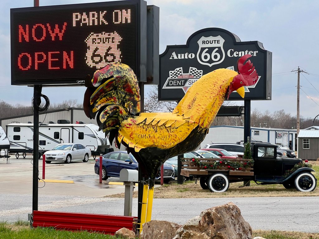 Park on 66 entrance sign and iconic rooster landmark