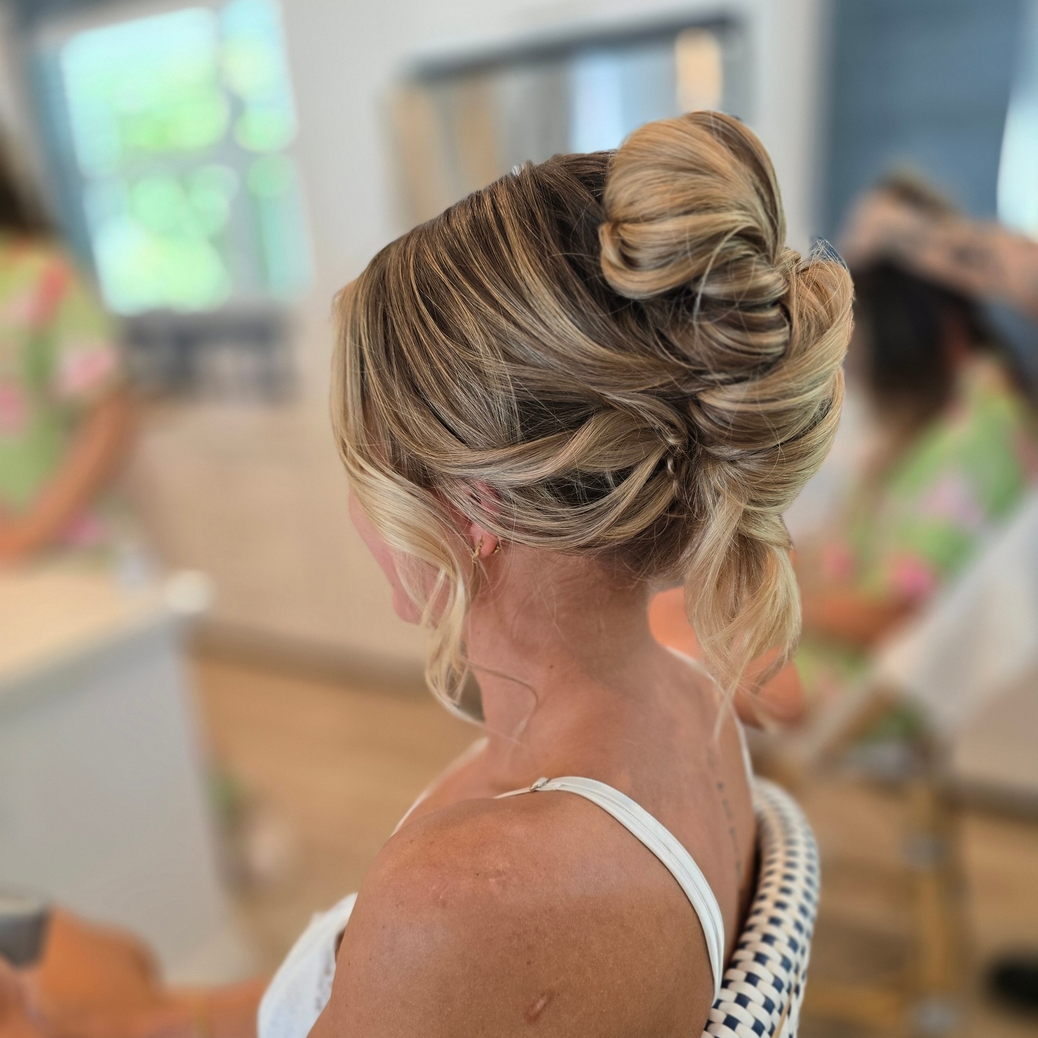 Textured blonde updo with cascading curls
