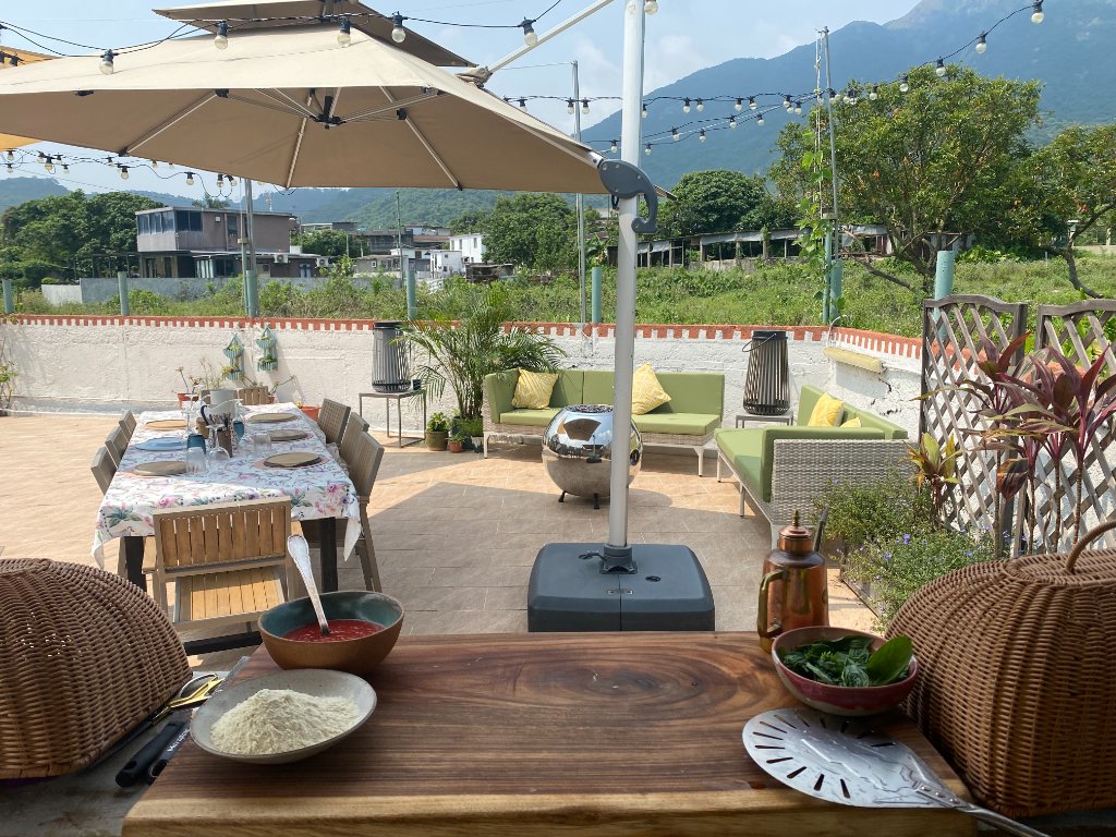 Pizza station with mountain views and string lights
