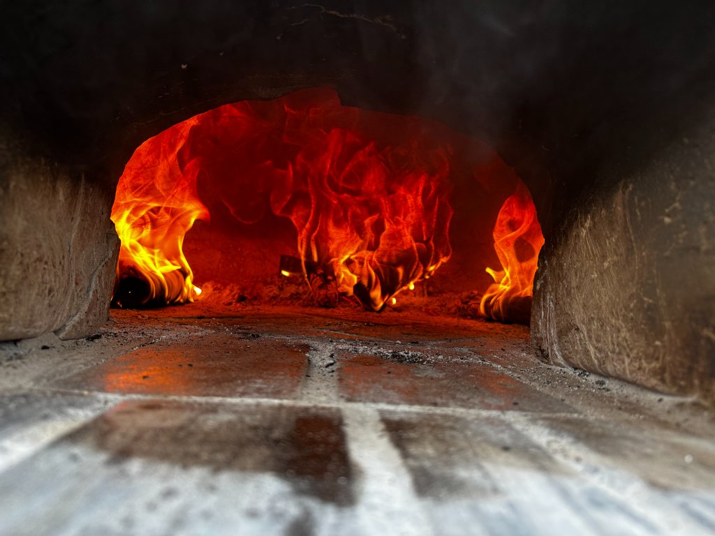 Roaring woodfire oven flames