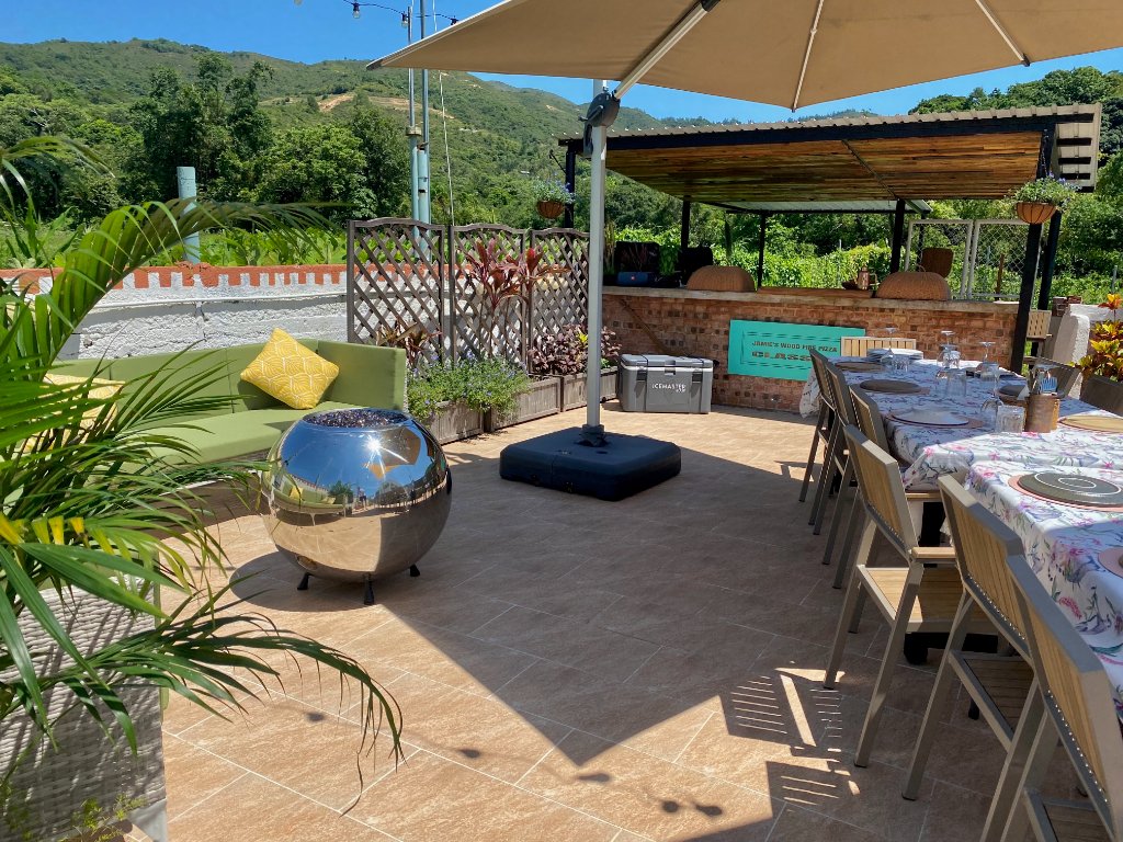 Outdoor terrace dining area with mountain views