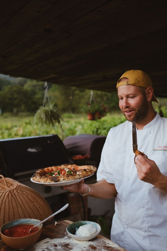 Jamie tending the woodfire oven