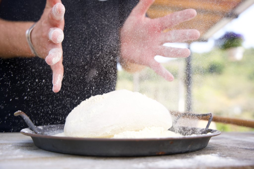 Flour dusting over dough ball