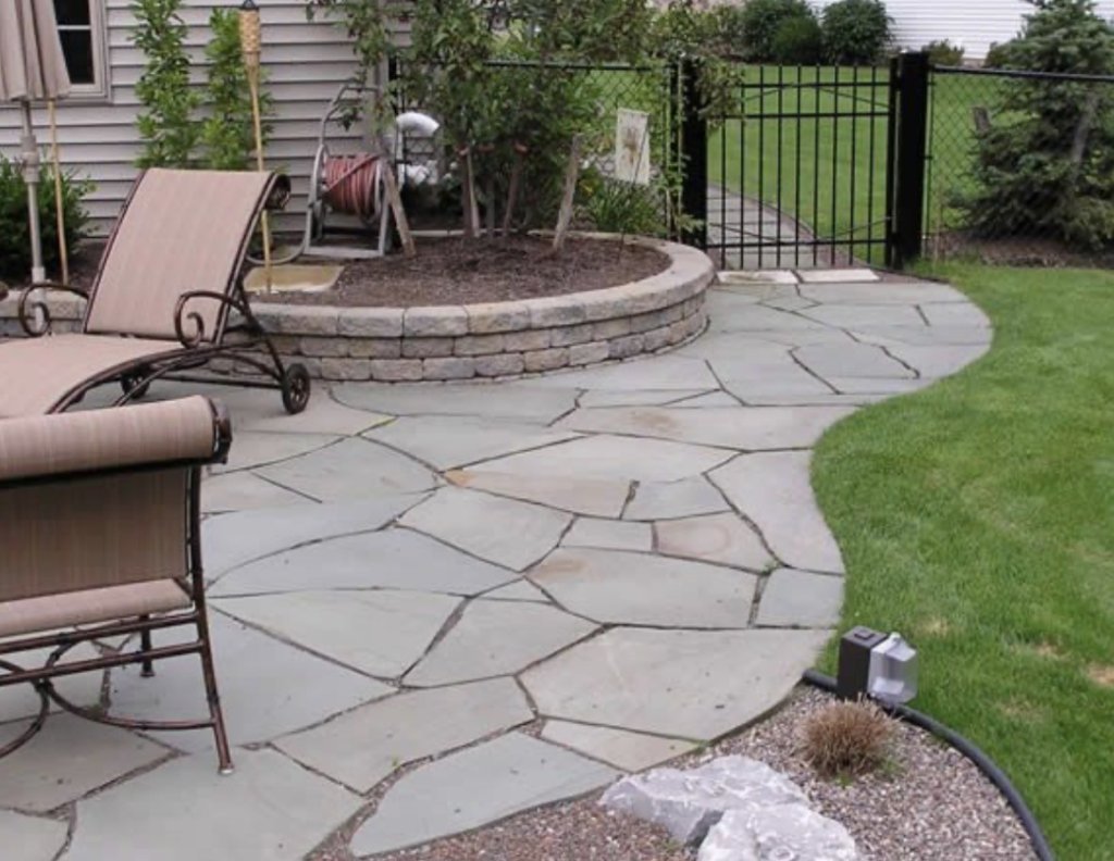 Flagstone patio with raised garden bed
