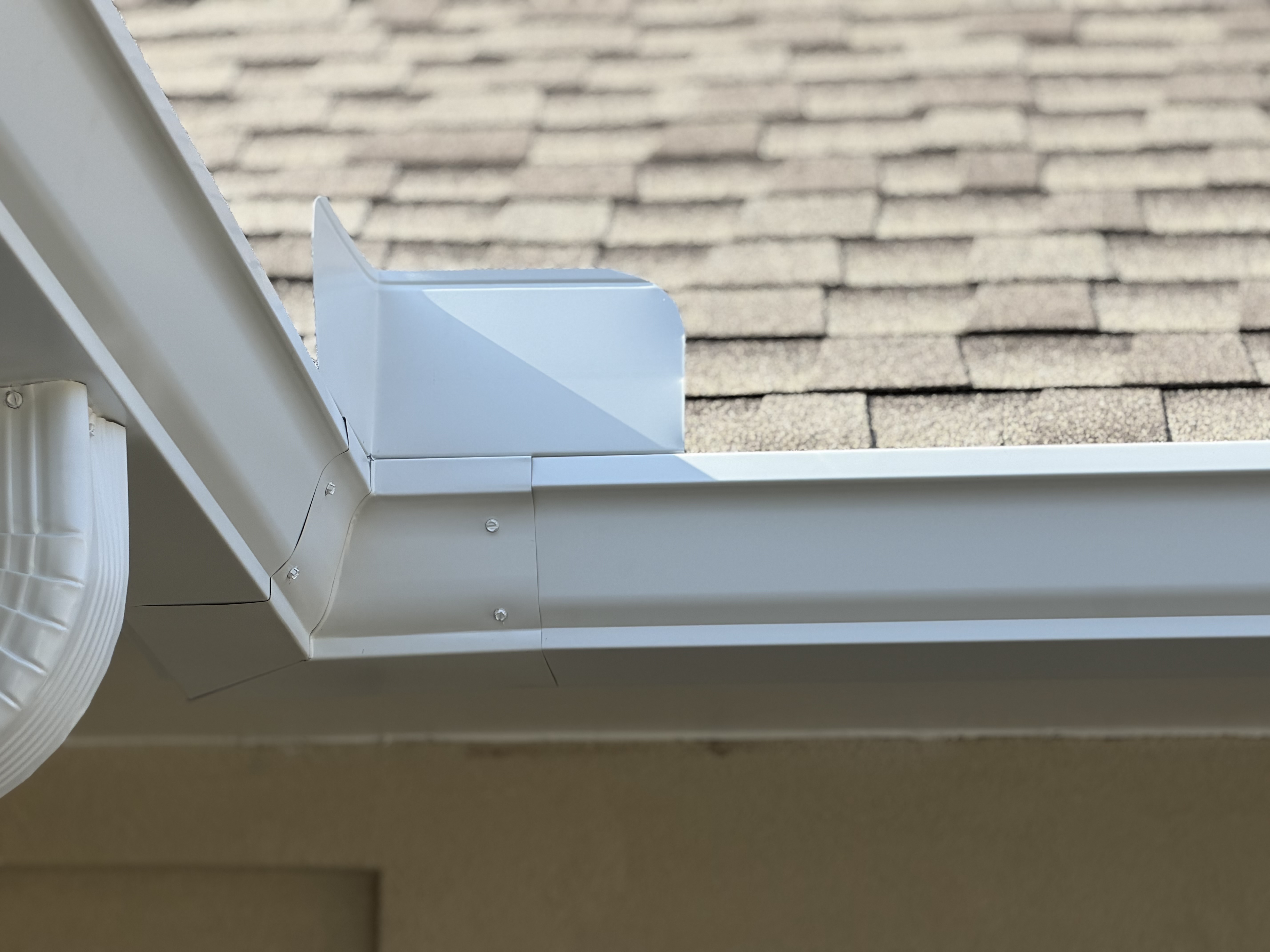 New gutter at outside corner with aluminum clad fascia
