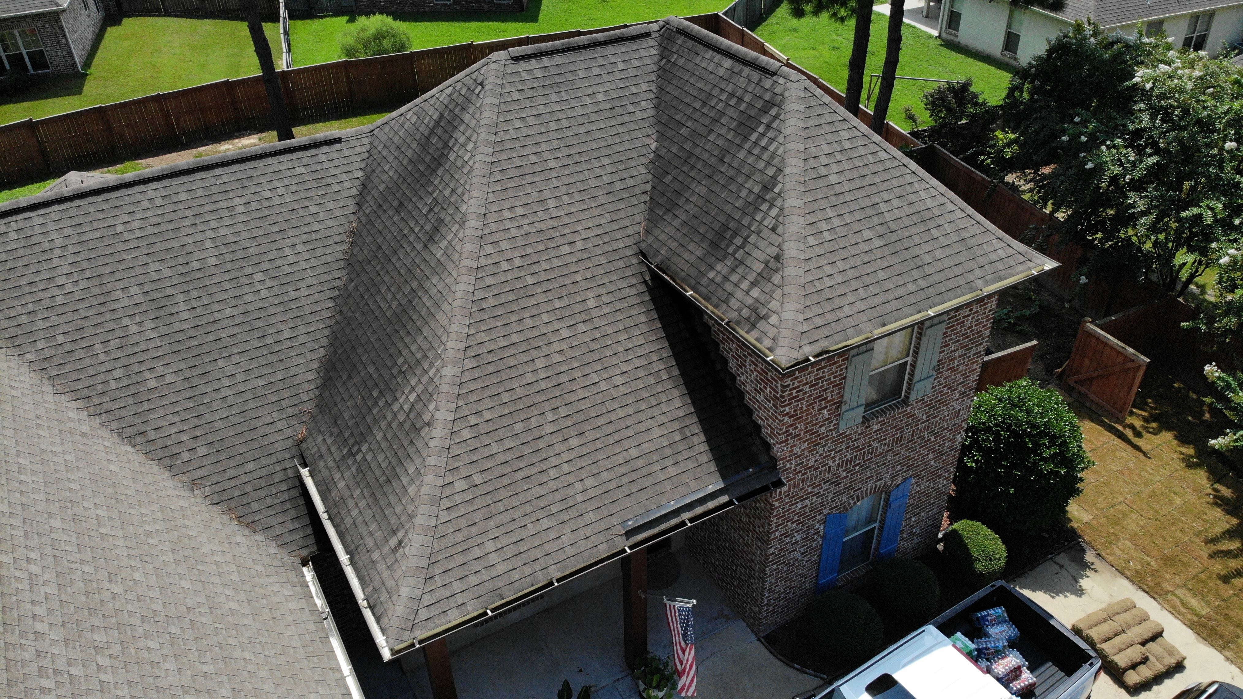 Aerial view of a residential roof showing overall shingle condition and geometry