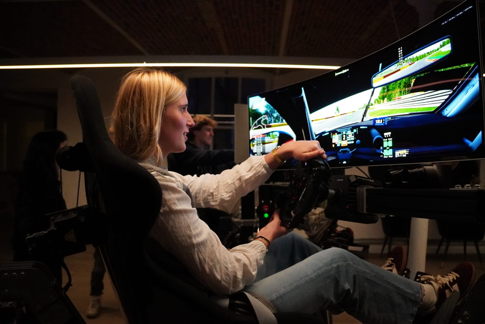 Friends celebrating at racing simulator center