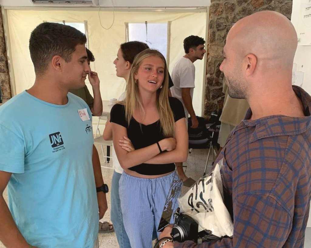 In conversation with participants at a program under review.