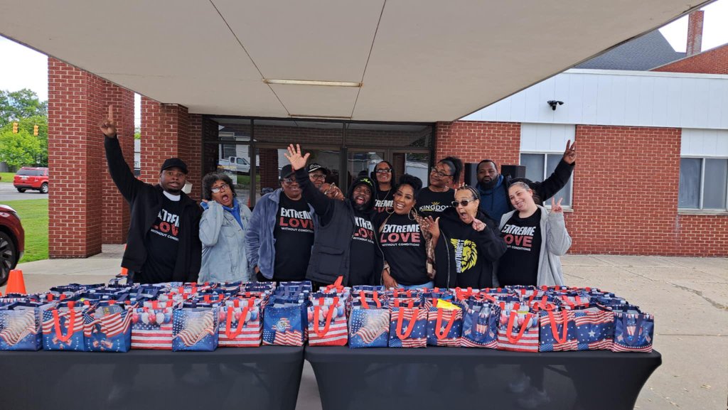 Volunteers serving families at a community outreach event