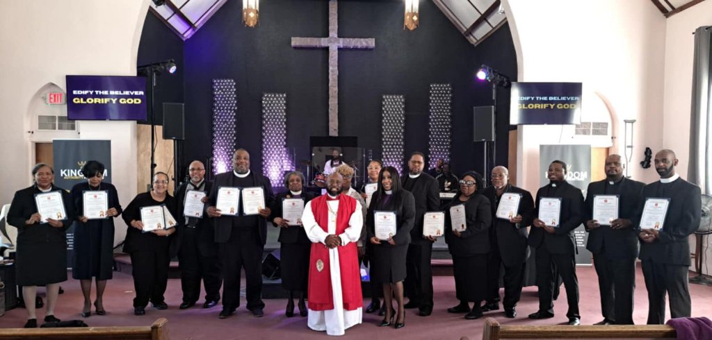 Apostolos University Graduation — graduates holding credentials