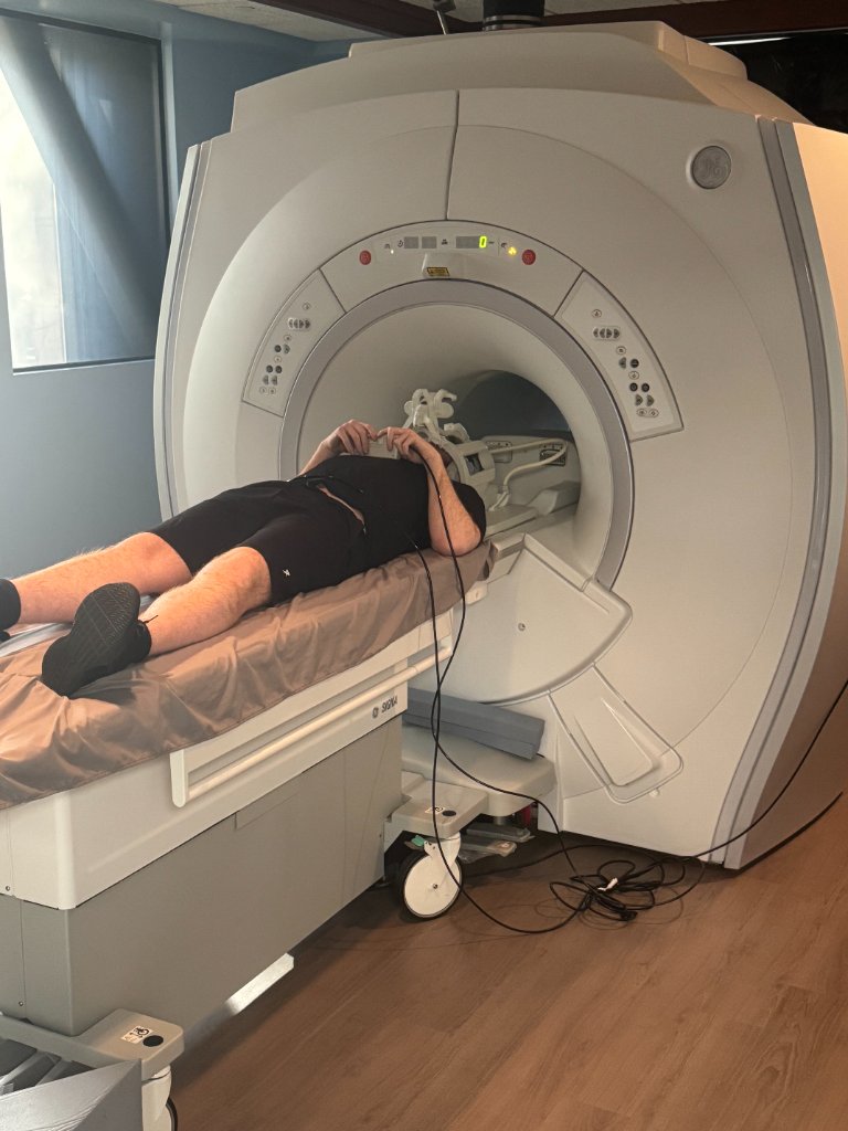Subject positioned inside the GE SIGNA fMRI scanner at Cognitive FX
