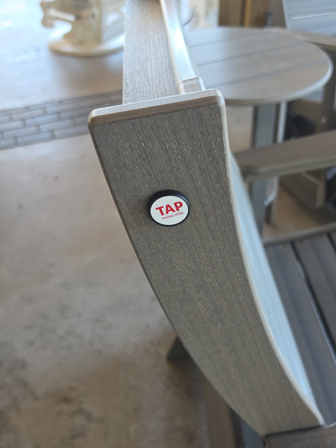 Patio Vault Tap Phone Here NFC tag on participating furniture at Props Brewery