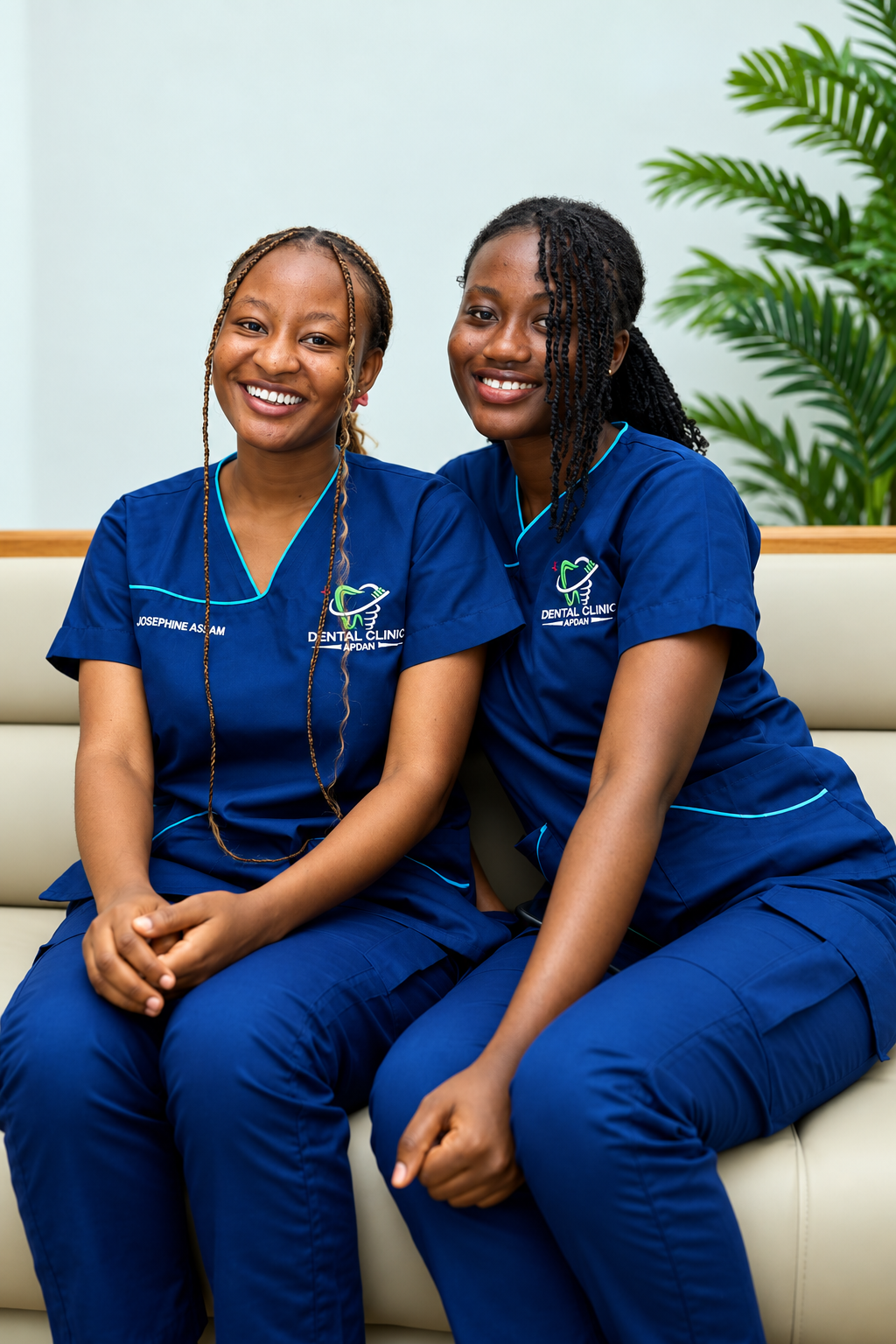 Two smiling APDAN dental assistants seated together