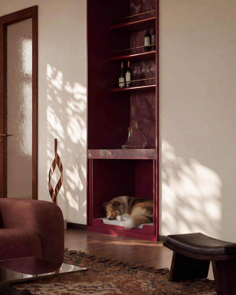 Medium long-haired dog sleeping curled inside a tall burgundy furniture niche with shelving above.