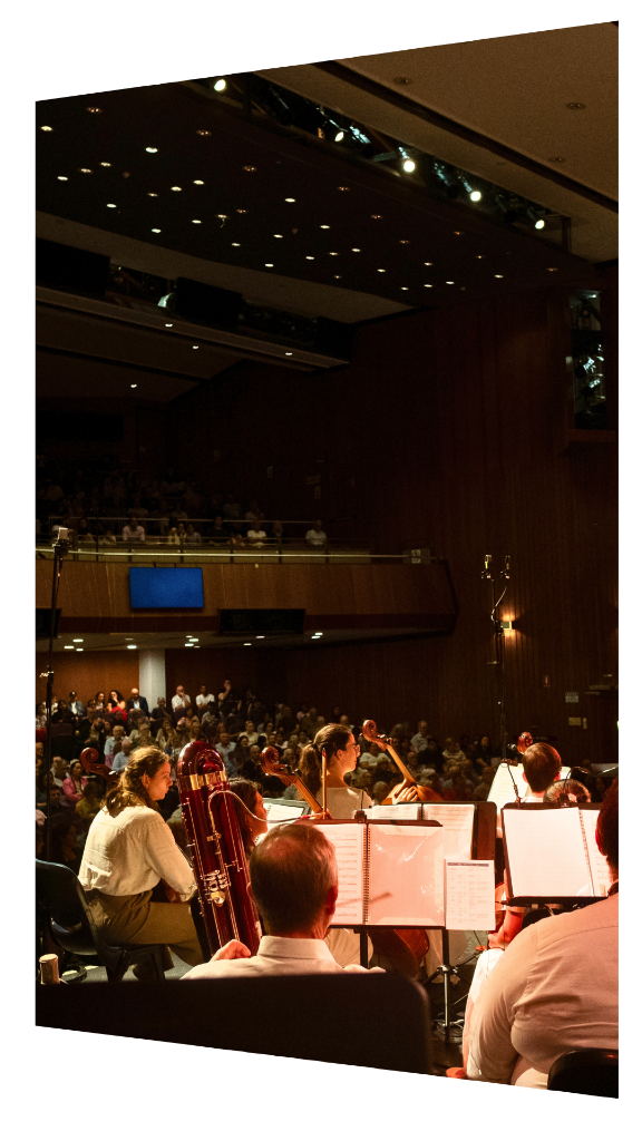 Orchestra on stage with full audience