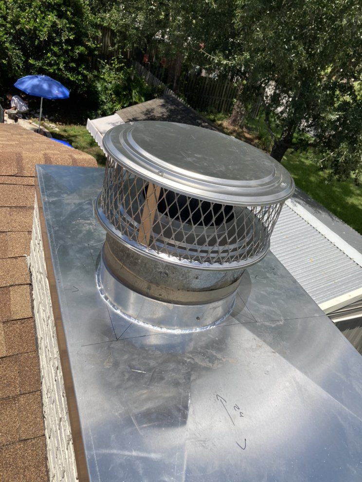 Chimney cap on tile roof