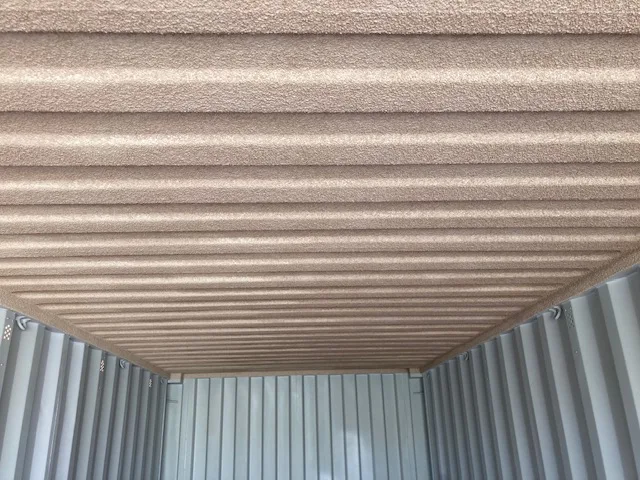 VIPEQ Thermal Cork Spray applied to shipping container ceiling — close-up of finished texture
