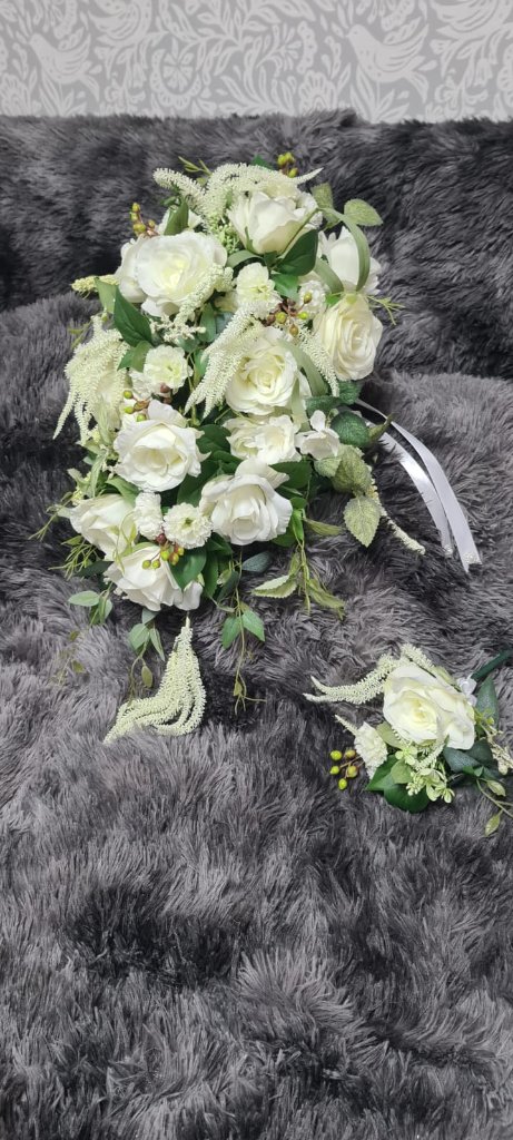 Artful flat lay of loose flower stems on natural linen