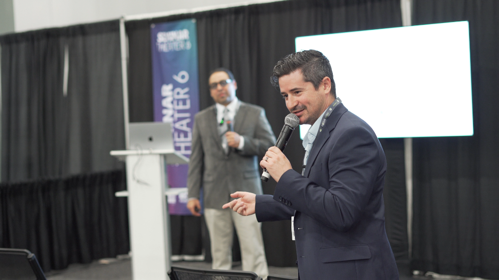 Jason Dzamba presenting on stage