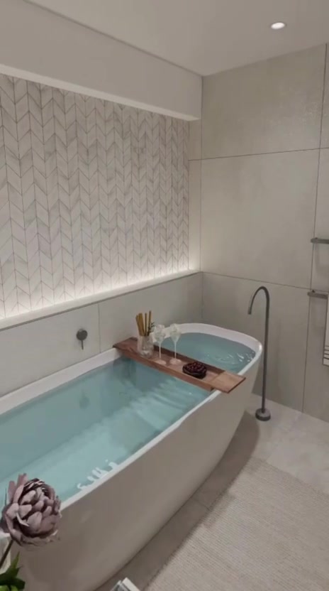 Render de baño con bañera exenta y pared de espiga