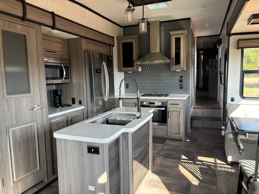 Luxury camper trailer on private Oklahoma property at sunset