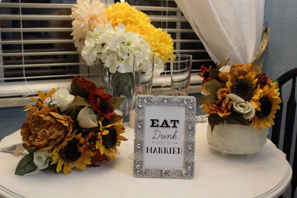 Wedding florals and eat drink and be married sign