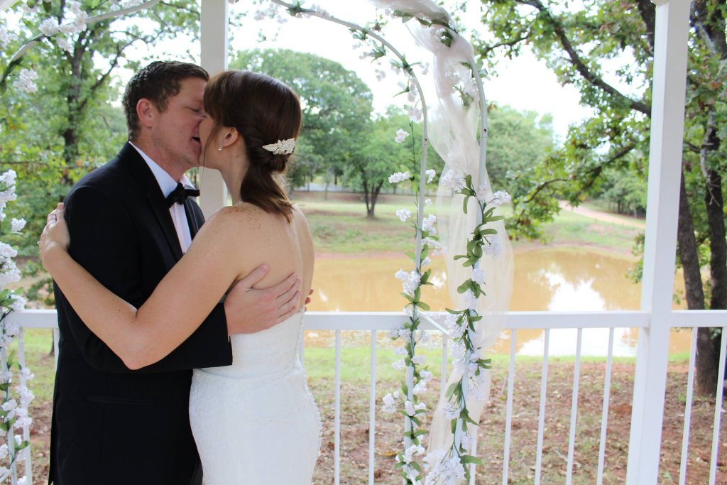 First kiss at the pavilion overlooking the pond