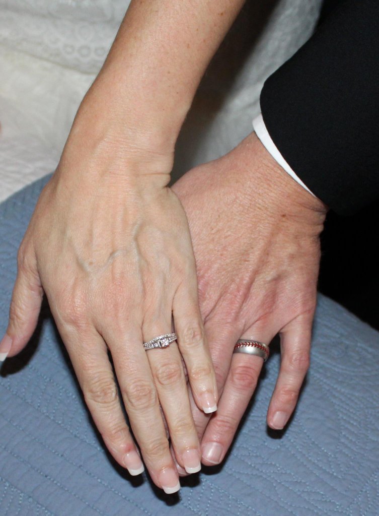 Wedding rings on couple's hands