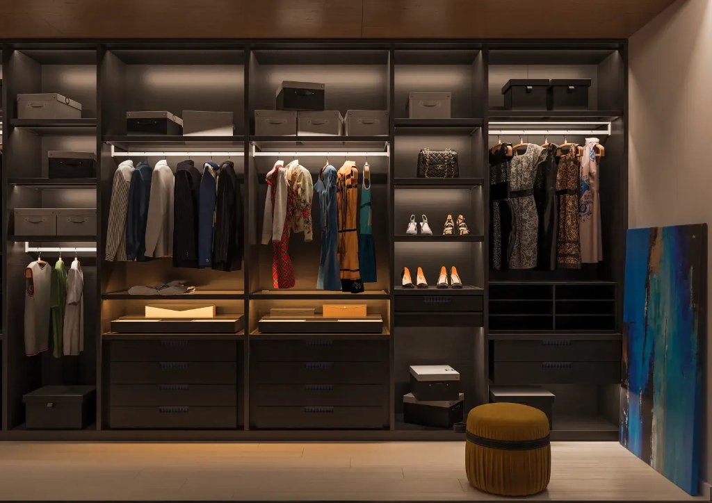 Custom residential closet and wardrobe with integrated LED and full-height hanging sections