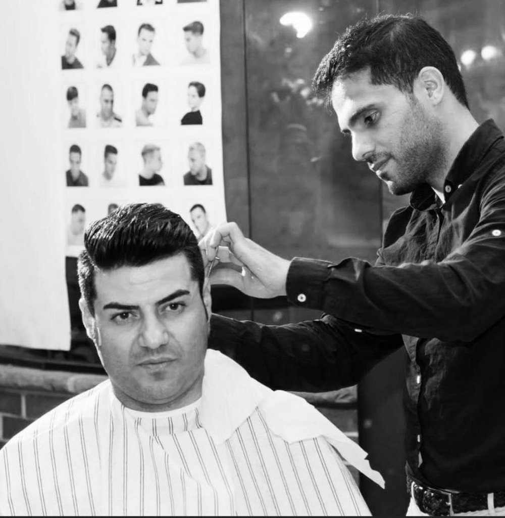Expert barber cutting hair at Patchi Alotchi