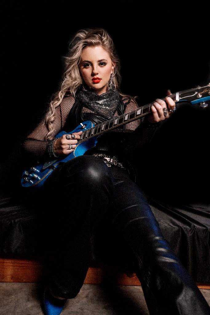 Kate Watson playing blue guitar
