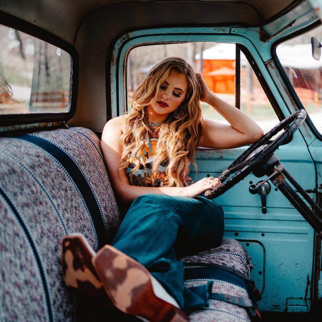Kate Watson in a vintage truck