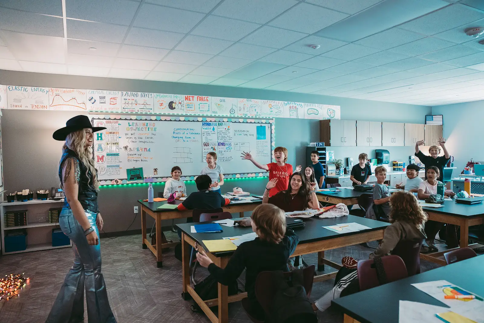 Kate Watson speaking with students in a classroom
