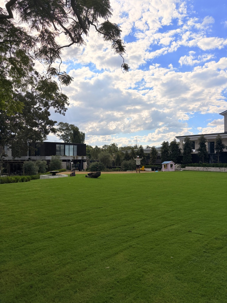 Expansive lawn with fountain feature