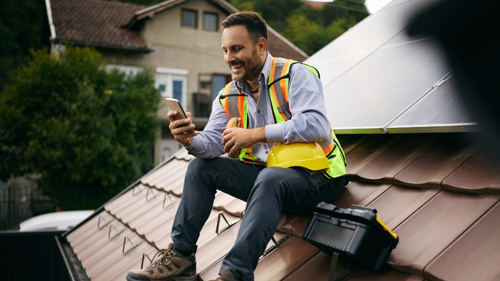 Contractor texting on phone