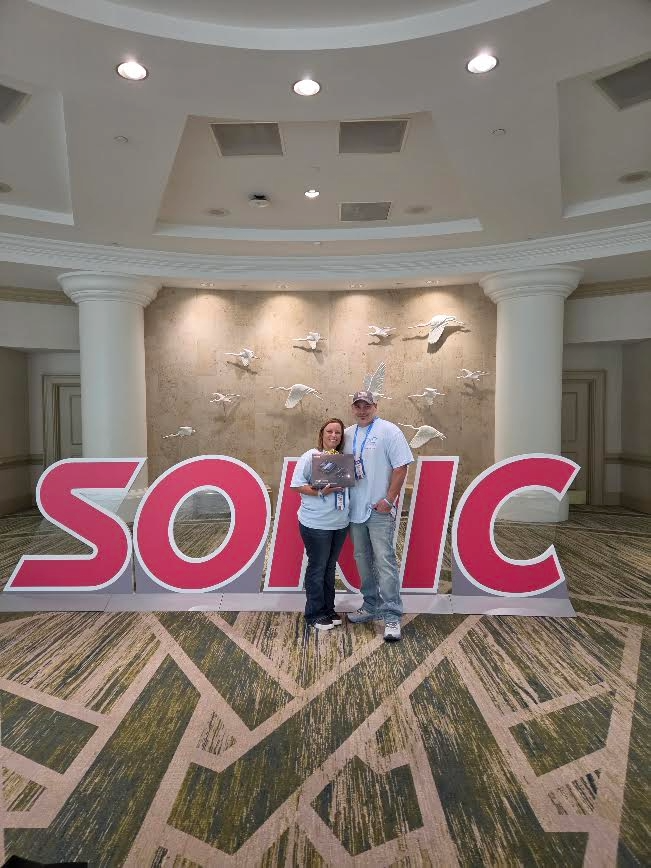 Drone raffle winner Brittany Clark with the TPSO USA team at the 2026 National Convention