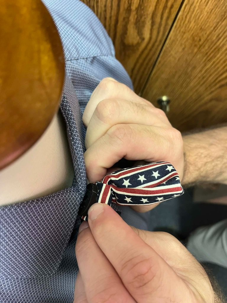 Step 2: Hold the tie