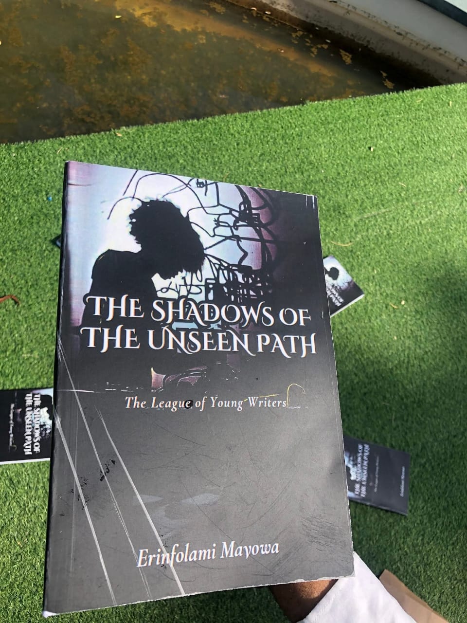 Founder with book cover