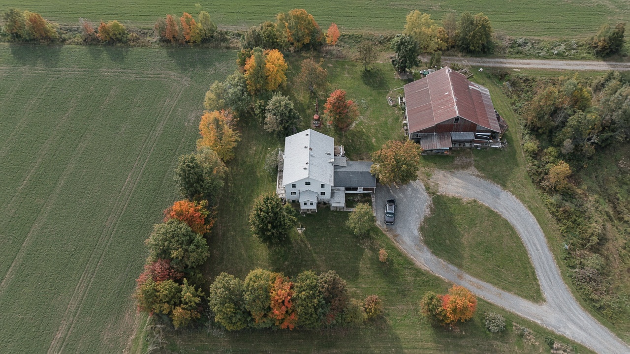 Aerial view of a rural property and outbuildings