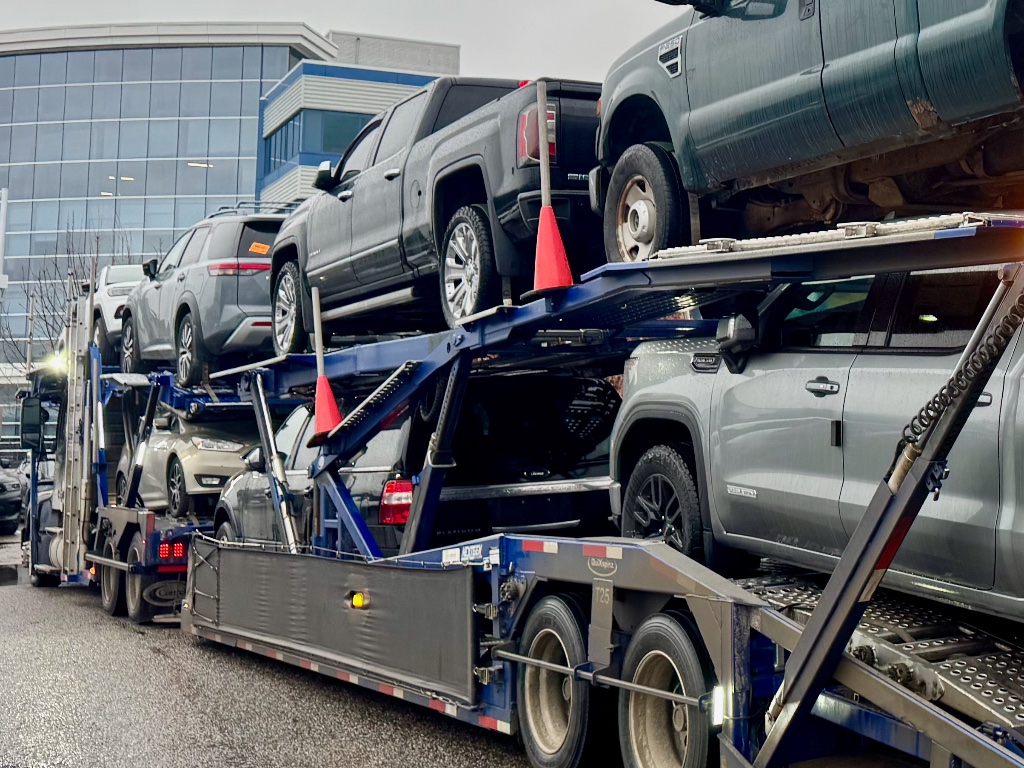 Close-up of heavy-duty tie-down equipment on a car carrier