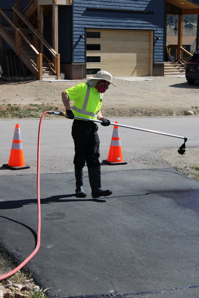 Kyle crack filling an asphalt surface in Summit County