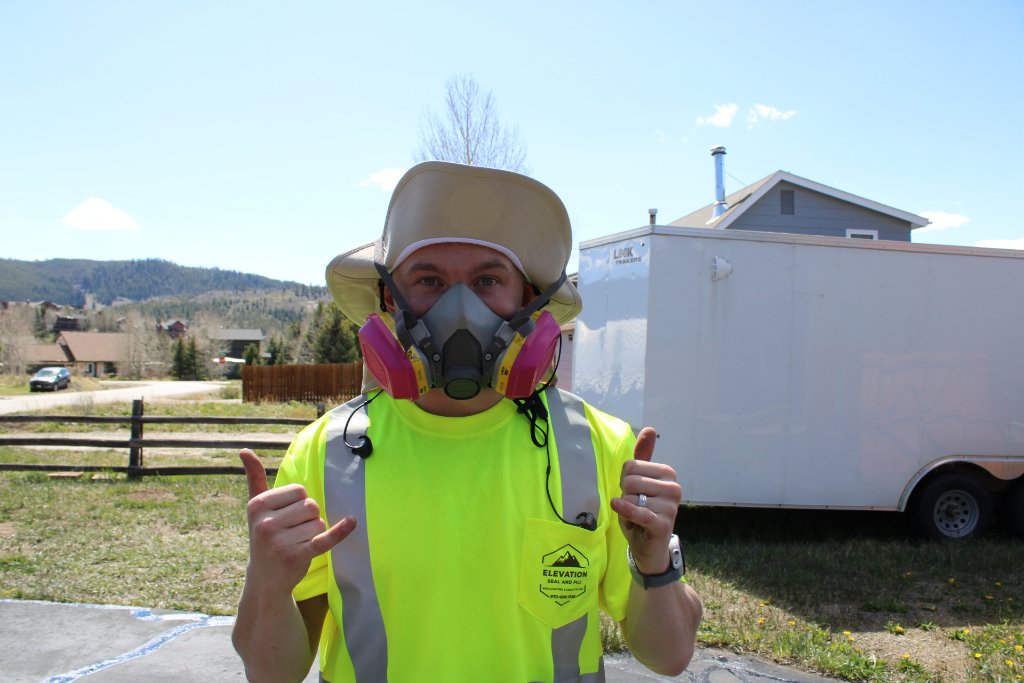 Kyle ready to work — thumbs up on the job site